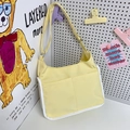 Pale yellow hobo bag with dual pockets and white binding trim for casual wear - Yellow