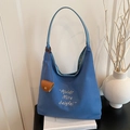 Large blue canvas tote bag with white embroidery and brown leather charm on books - Blue