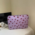 Purple laptop sleeve with cherry print and dual zippers on a minimalist white desk - Purple