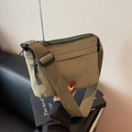 Minimalist olive green nylon messenger bag with wide strap and zip closure - Green