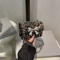 Stylish leopard print crossbody bag featuring a large silver bow and elegant chain strap - Dark Brown