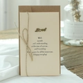 Retro greeting card with kraft envelope, twine bow and bronze Love metal charm - LOVE