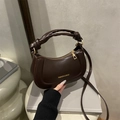 Dark brown crescent shoulder bag with knotted handle and gold-tone hardware detail - Brown