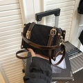 Black quilted crossbody bag with brown leather trim and vintage gold buckle closure - Black