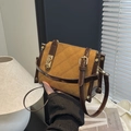 Quilted mustard yellow crossbody bag with dark brown trim and gold metal closure - Brown