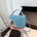 Light blue crossbody bag with matte finish and white stitching for stylish women - Blue