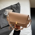 Minimalist beige leather crossbody bag with elegant gold metal lock and wide shoulder strap - Khaki