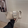 Cream retro baguette shoulder bag with oversized silver buckle and eyelet detail - Khaki