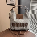 Sac fourre-tout en toile blanc cassé et cuir marron avec lettrage texturé unique - Gris