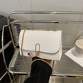 Chic white faux leather crossbody bag with gold chain strap and oval metal buckle - White
