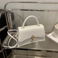 Structured white leather handbag with asymmetric hourglass base and golden hardware - White