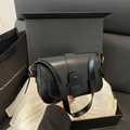 Minimalist black square shoulder bag with wide buckle strap and matte leather finish - Black