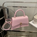 Minimalist light pink leather handbag with golden twist lock and adjustable shoulder strap - Pink
