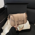 Elegant beige vintage flap crossbody bag on a black gift box with adjustable strap - Khaki