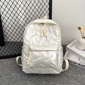 Quilted pearl white puffer backpack with glossy finish and minimalist weaving puller - Off White