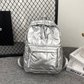 Chic silver quilted backpack featuring a metallic finish and large storage capacity - Silver