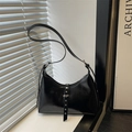 Modern black crescent shoulder bag with metallic rivets and sleek faux leather finish - Black