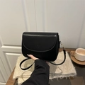 Classic black saddle bag in vegan leather with embossed fashion lettering and slim strap - Black