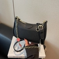 Chic black lychee texture crescent shoulder bag with golden strawberry chain charms - Black