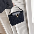 Chic black leopard print handbag featuring a luxurious gold V-shaped metal buckle accent - Black