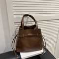 Deep brown matte leather tote bag with gold metal twist lock and drawstring details - Brown
