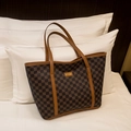 Brown diamond pattern tote bag with leather handles and gold metal logo plaque - Brown