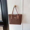 Leopard print tote bag met gouden strik detail en bruine lederen handvatten - Bruin