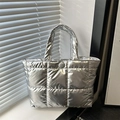Silver quilted puffer tote bag with metallic finish and padded handles for women - Silver