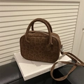 Vintage dark brown leopard embossed crossbody bag with dual handles on a white book - Basic Style / Brown
