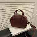 Minimalist reddish-brown suede handbag with round top handles and adjustable strap - Red