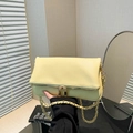 Pale yellow leather shoulder bag with gold chain and dual zipper details - Yellow