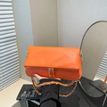 Vibrant orange pebble leather crossbody bag with dual zipper and gold chain strap - Orange