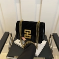 Black velvet crossbody bag with V-shaped quilting and gold square metal clasp detail - Black