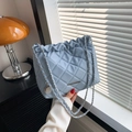 Light blue quilted crossbody bag with silver chain strap and pleated detail - Blue