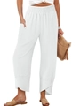 Detail of high waisted white wide leg pants featuring smocked waist and petal cut hem - S / White