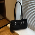 Retro black faux suede underarm bag with silver buckle on a cozy sunlit window - Black