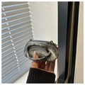 Close-up of small marbled crossbody bag with artistic gray patterns and gold chain - Gray