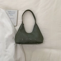 Detail view of olive green crescent shoulder bag with vertical stripe leather texture - Green