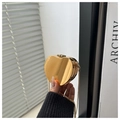Close-up of golden mirror heart-shaped metal clutch bag with slim gold chain strap - Gold Apple