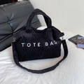 Black corduroy tote bag with embroidery, featuring a wide detachable shoulder strap - Black