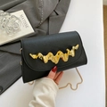 Elegant black evening clutch with wave-shaped gold metal hardware and chain strap - Flap Clutch Style / Black