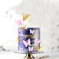 Detail view of 3D pink and gold butterfly cake toppers with Happy Birthday sign decorations - Gold Birthday Style (4 Gold + 8 Pink)