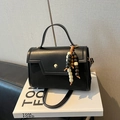 Black leather baguette handbag with vintage wooden bead charm and gold metallic buckle - With Pendant / Black