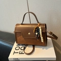 Vintage brown leather baguette bag with beaded tassel and golden circular hardware - Brown (With Pendant)