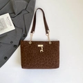 Brown leopard print tote bag with gold deer pendant and chain handle on a stylish background - Brown