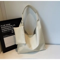 Detail of cream white leather tote bag with natural lychee texture and matching small pouch - Off White