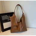 Detail of caramel retro leather hobo bag with matching small zippered inner pouch - Brown