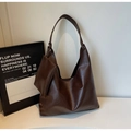 Detail of vintage coffee brown tote bag featuring knotted strap and hanging coin purse - Coffee