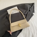 Minimalist beige baguette bag with golden buckle on dark gray blazer for women - Khaki