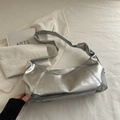 Minimalist metallic silver underarm bag with high-gloss texture and knotted strap detail - Silver